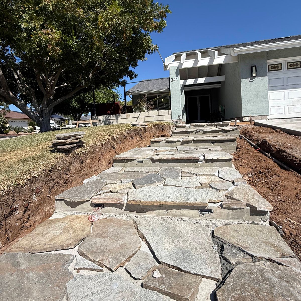 Natural flagstone walkway being installed at a San Marcos home