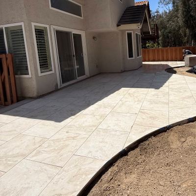 Concrete patio with a curved edge being finished, Carlsbad