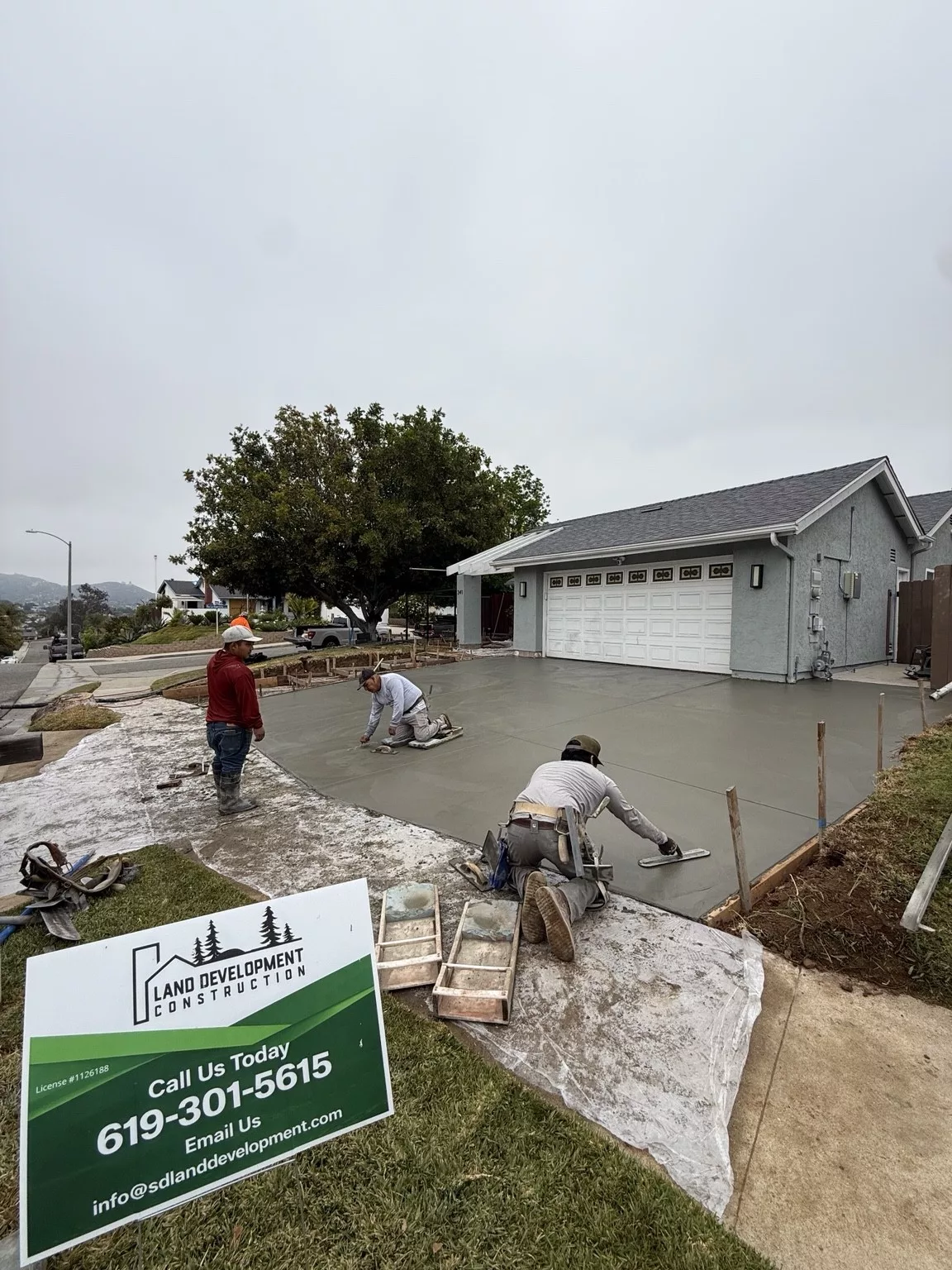 Concrete driveway finishing during construction