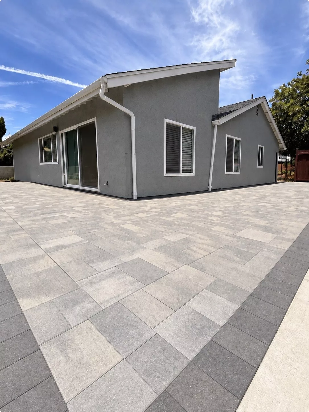 Finished side and backyard paver surface at a San Marcos home