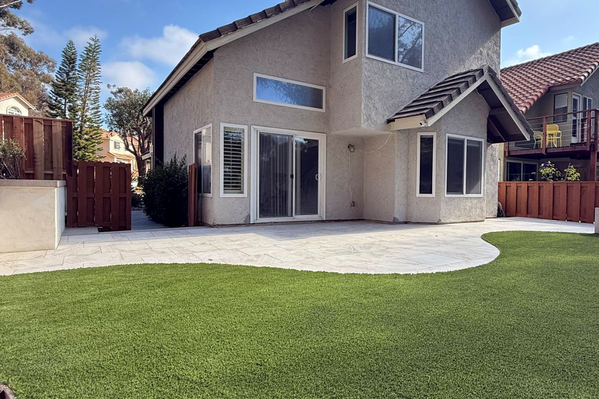 Artificial turf lawn beside a curved concrete patio, Carlsbad