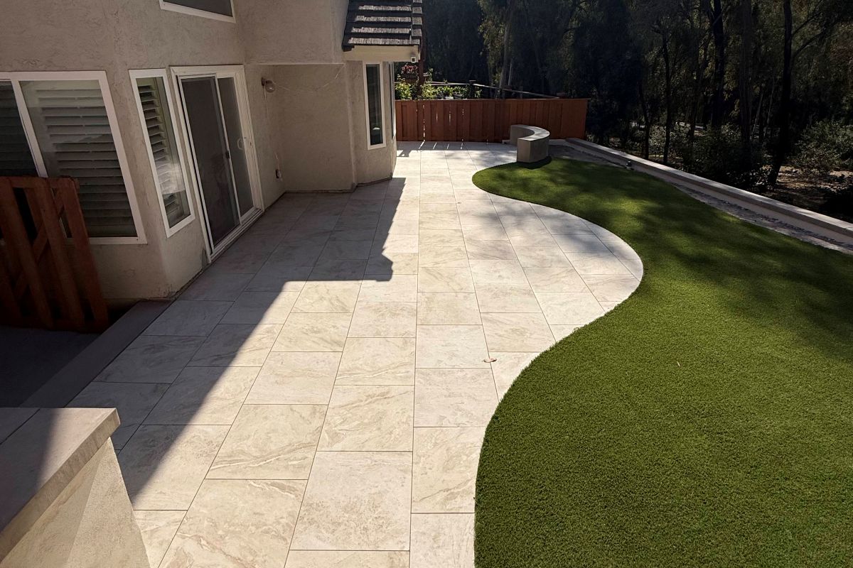 Artificial turf meeting a curved concrete patio, Carlsbad