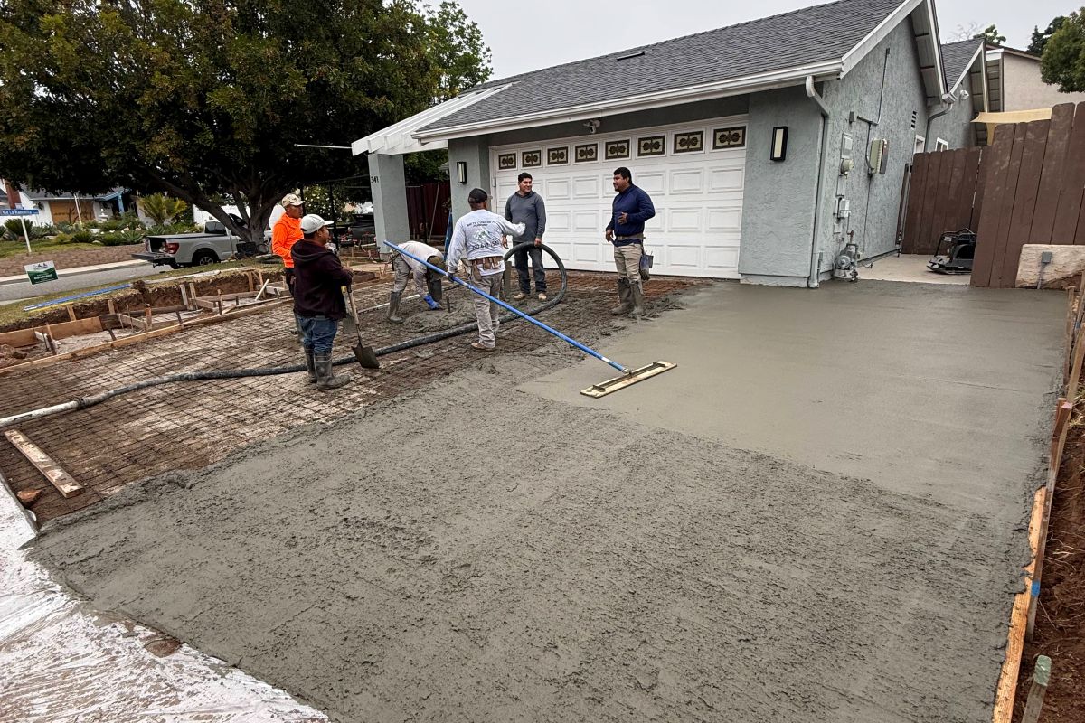 Crew finishing a concrete driveway slab, San Marcos