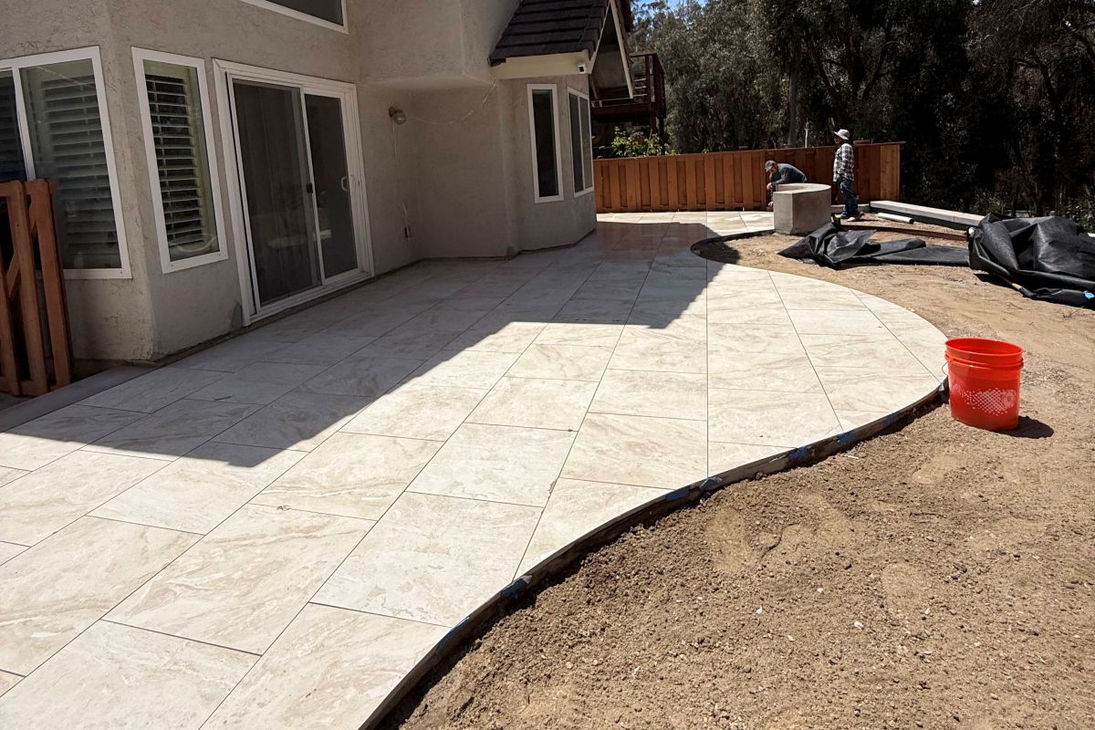 Concrete patio with a curved edge being finished, Carlsbad