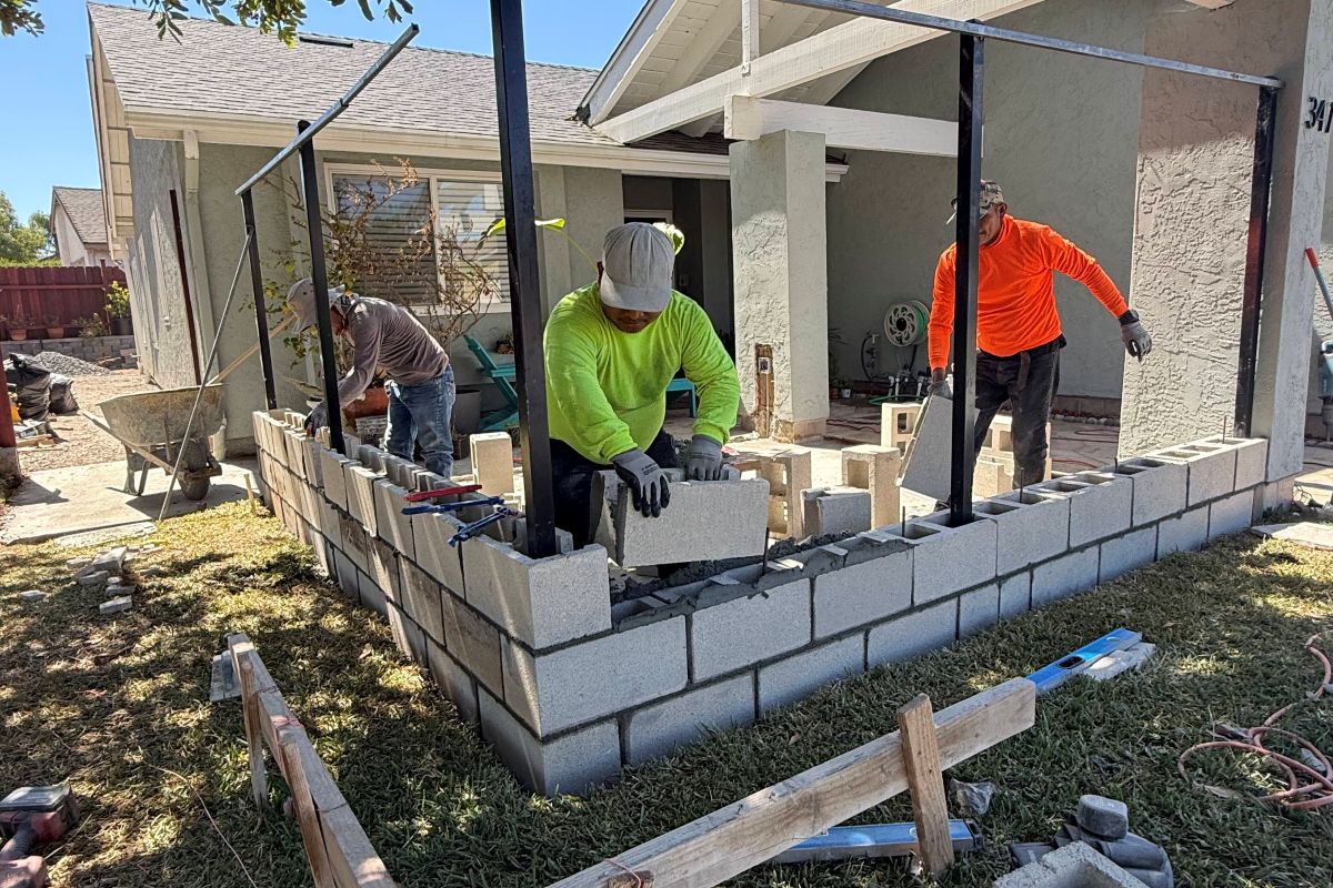 Block retaining wall under construction at an entry, San Marcos